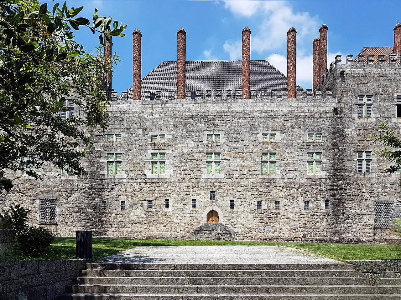 The Palace of the Dukes of Braganza in Guimarães, with its tall brick chimneys.
