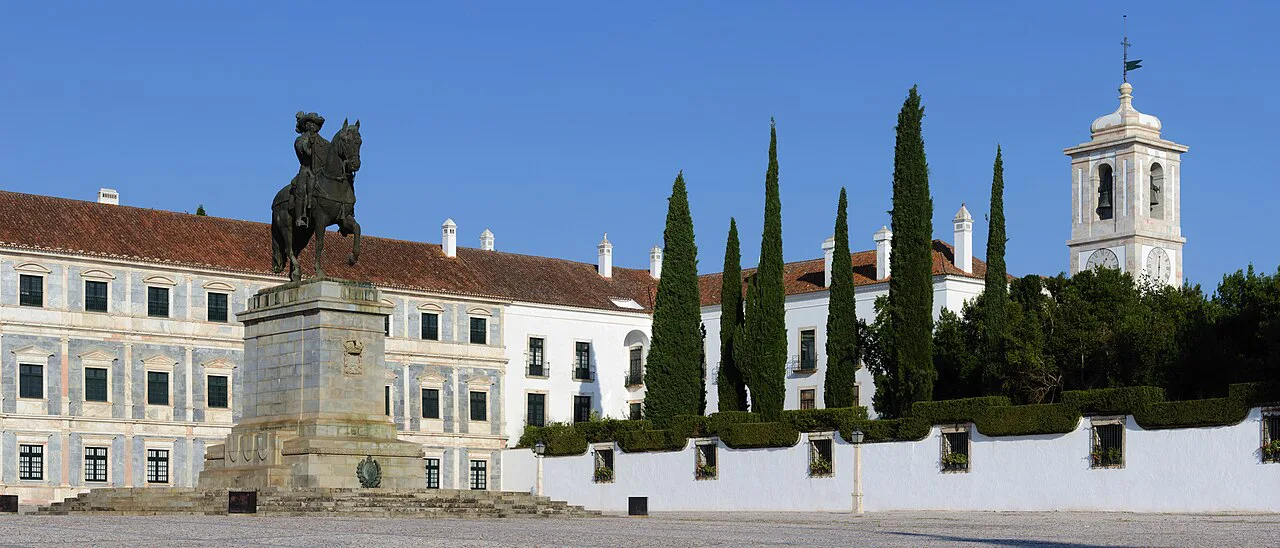 The Ducal Palace of Vila Viçosa with the statue of King João IV in front.