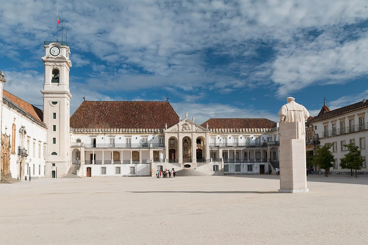 The clock tower and courtyard of the Pátio das Escolas at the University of Coimbra.