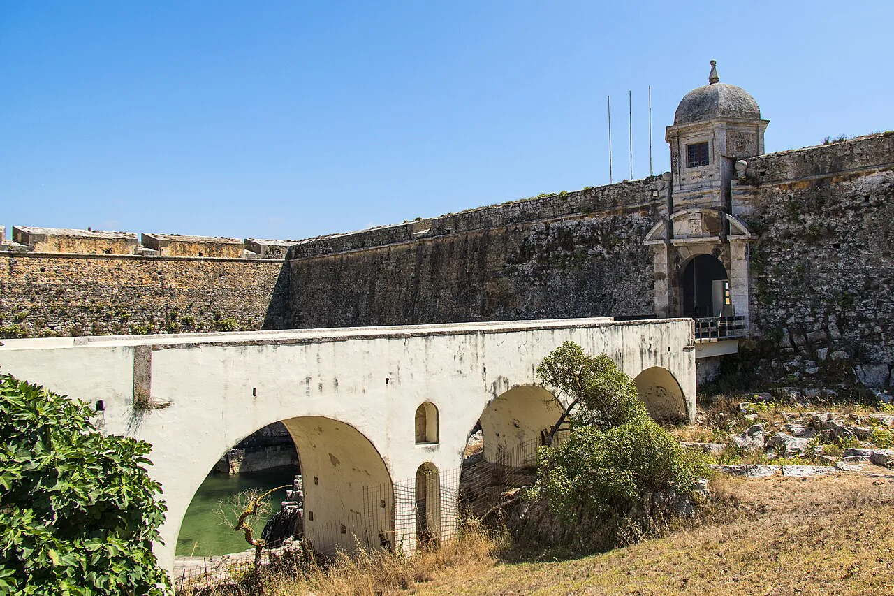 A stone bridge leading to the walls of Peniche Fortress.