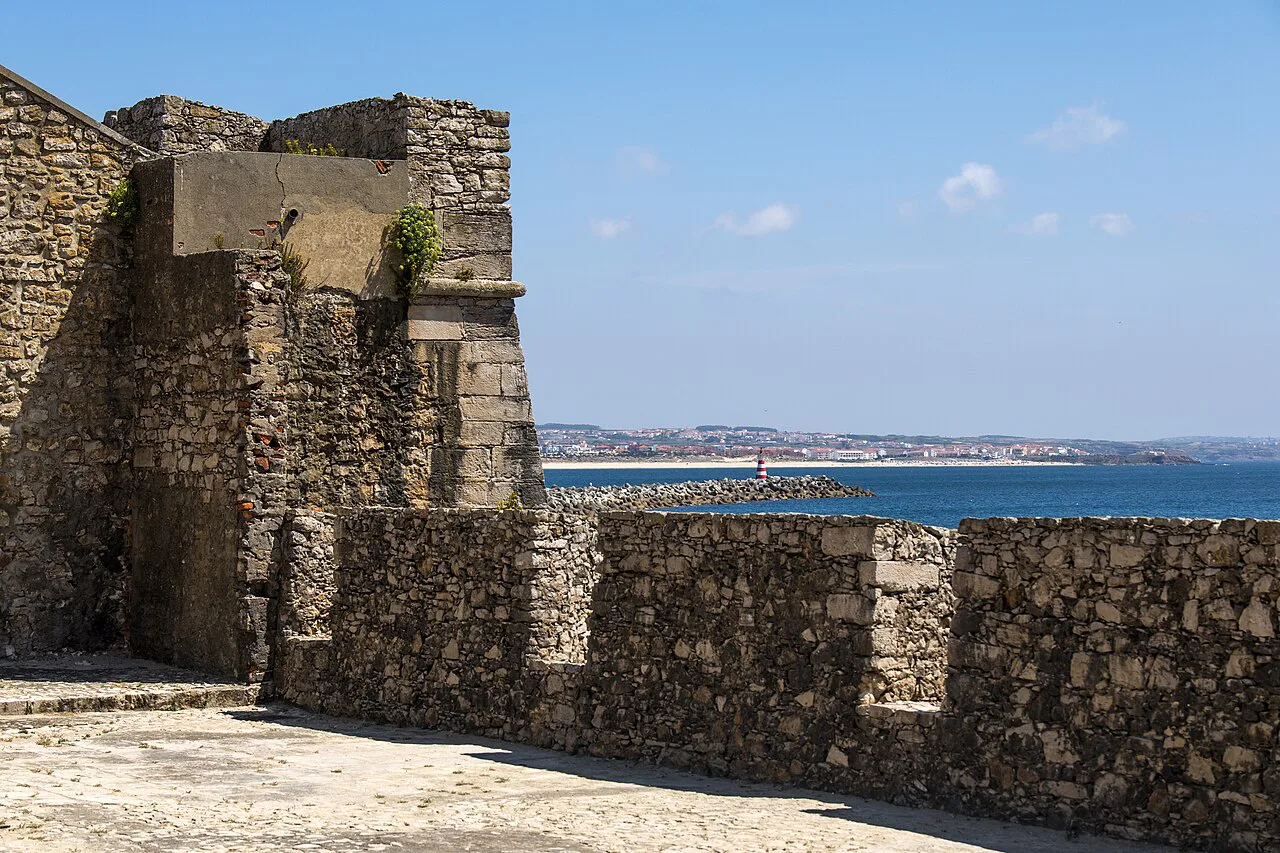 Stone walls of Peniche Fortress overlooking the sea.