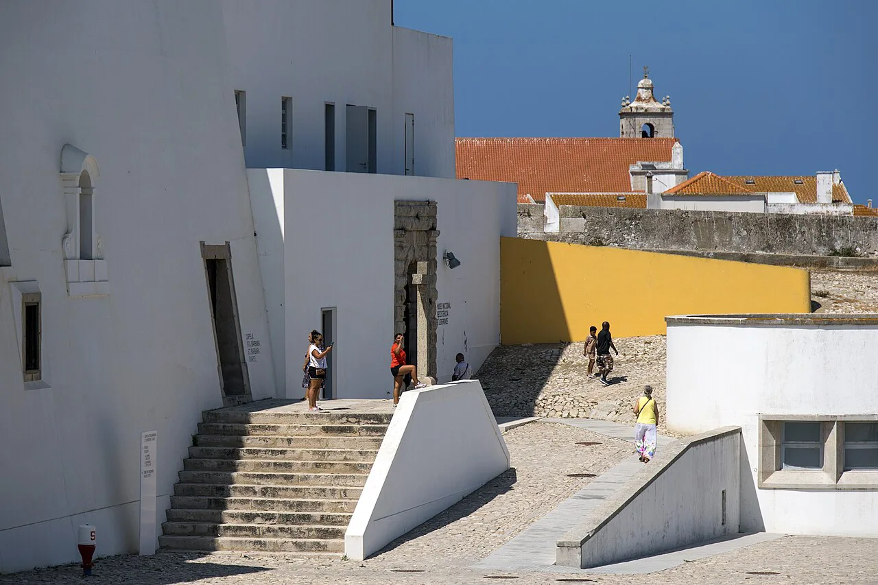 Steps and white buildings inside Peniche Fortress.
