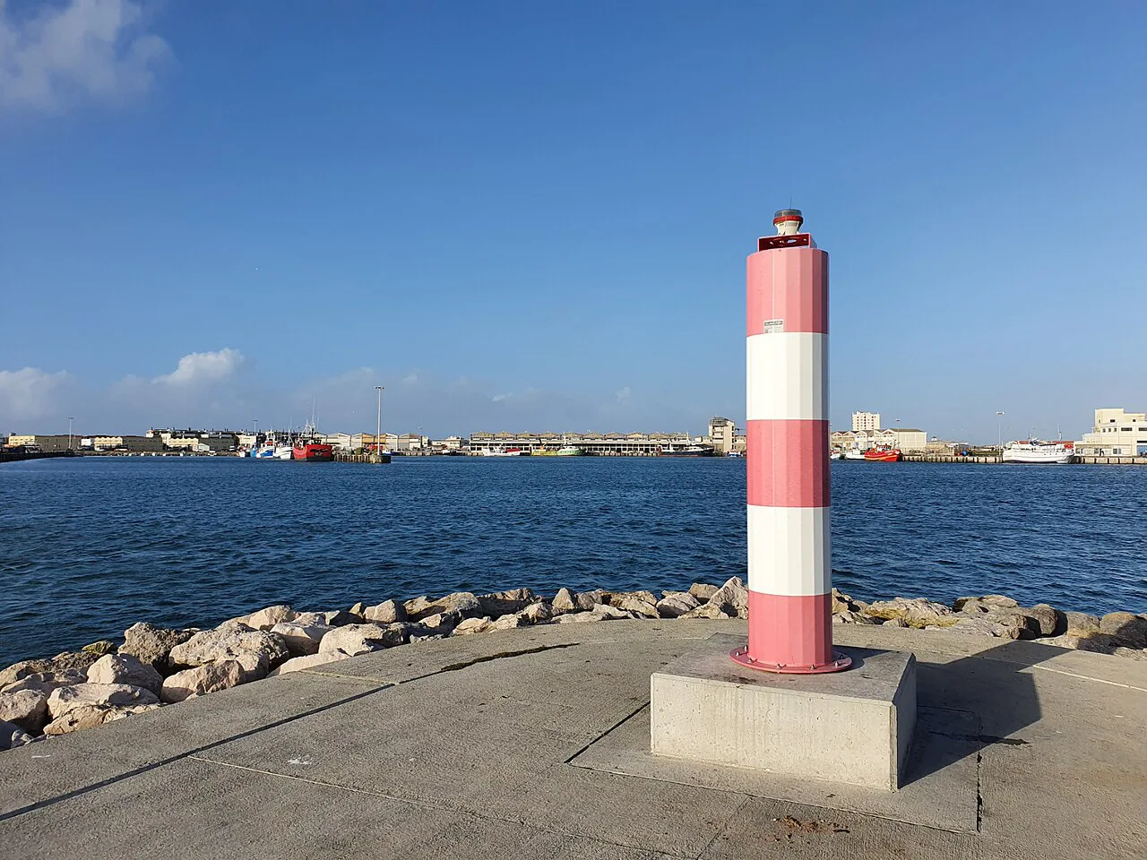 A harbour light on the breakwater at the port of Peniche.