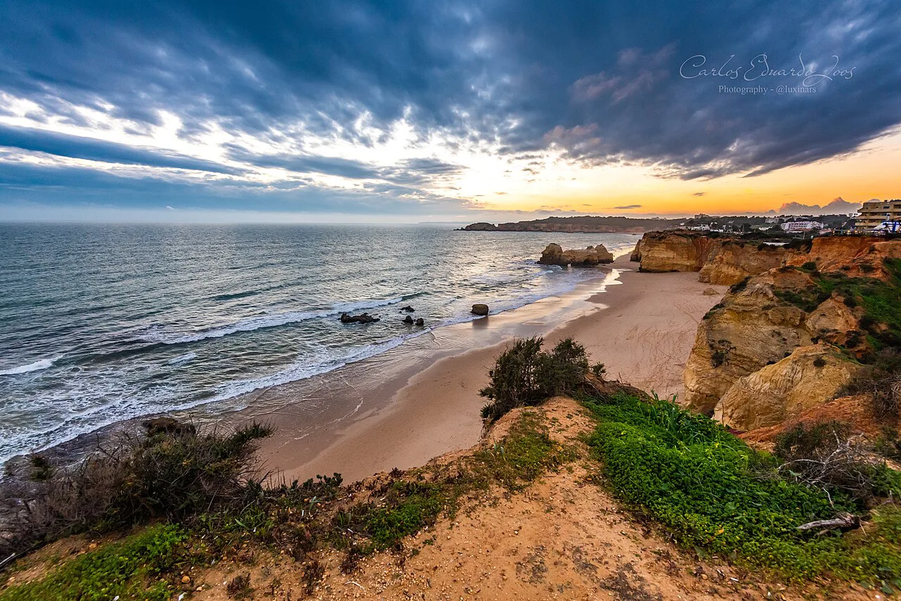 A sandy beach and cliffs on the coast of Portimão in the Algarve.