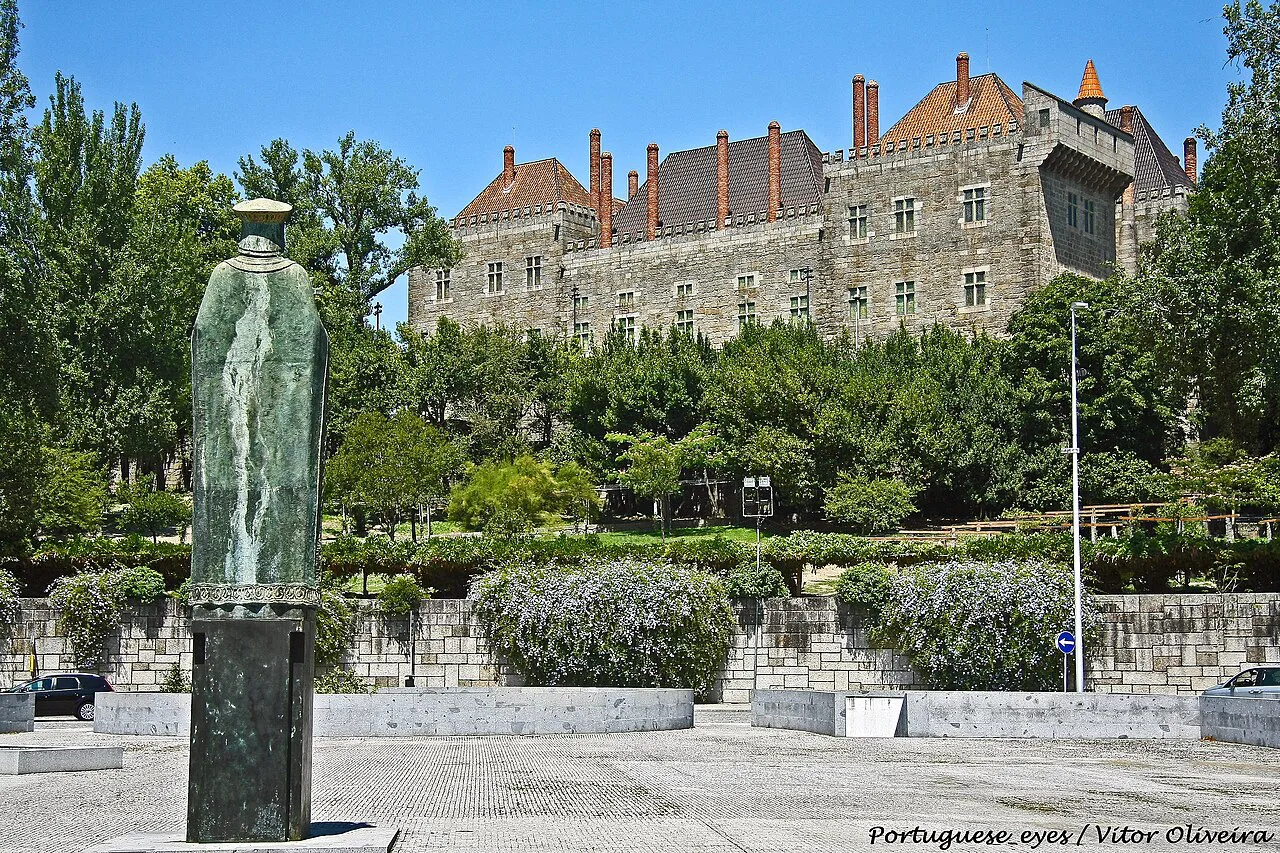 A stone palace above gardens in Guimarães.