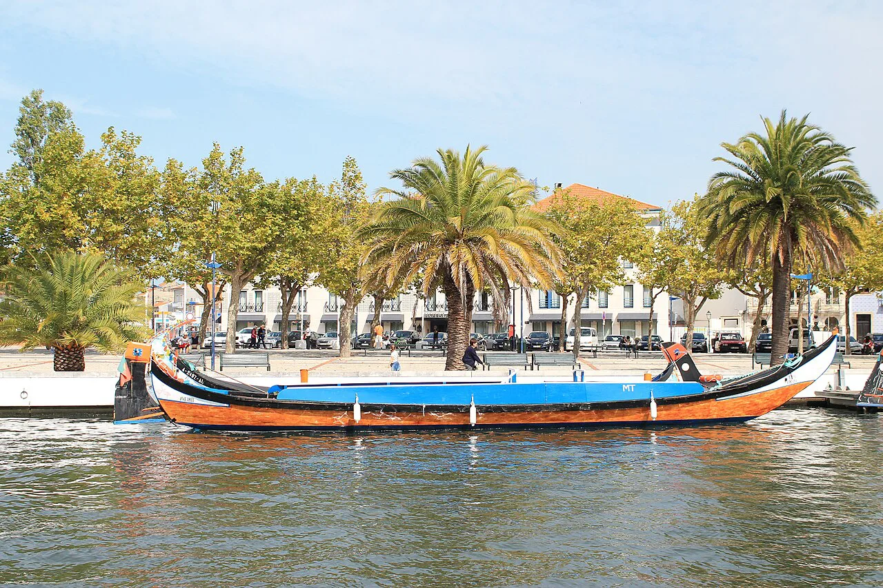 A painted moliceiro boat on a canal in Aveiro.