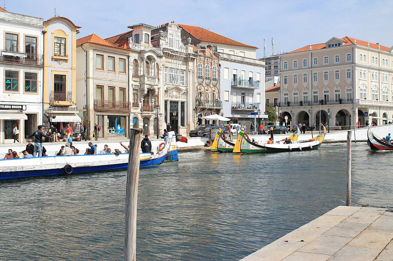 Moliceiro boats moored along a canal in Aveiro.
