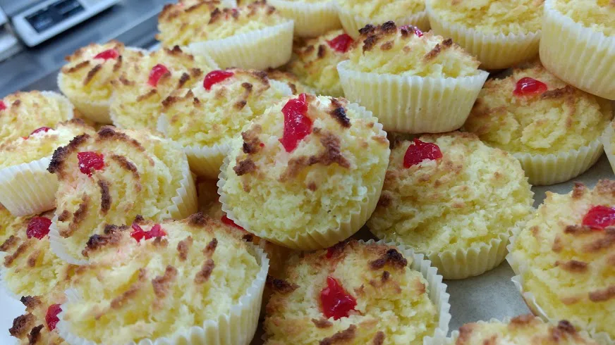 A tray of Portuguese coquinhos, small coconut cakes.