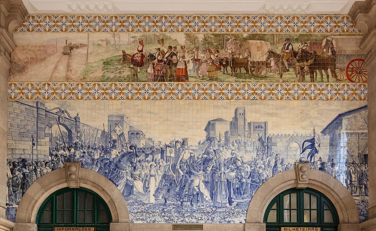 Blue-and-white azulejo scenes above the doorways of São Bento railway station in Porto.