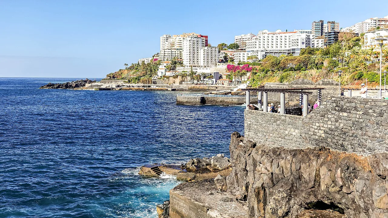 The rocky coastline of São Martinho in Funchal, with hotels above the sea.