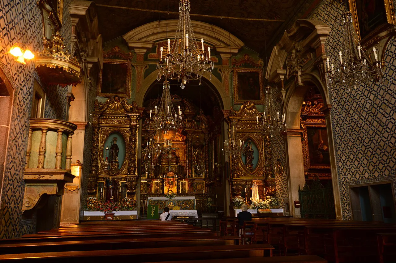 Gilded altars and tiled walls inside the Church of São Pedro in Funchal.