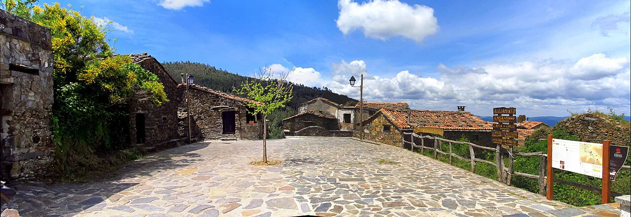 Schist houses around a paved square in the village of Talasnal in the Serra da Lousã.