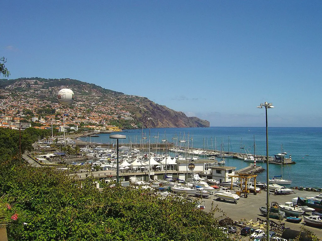 The marina and seafront of Funchal seen from a hillside.