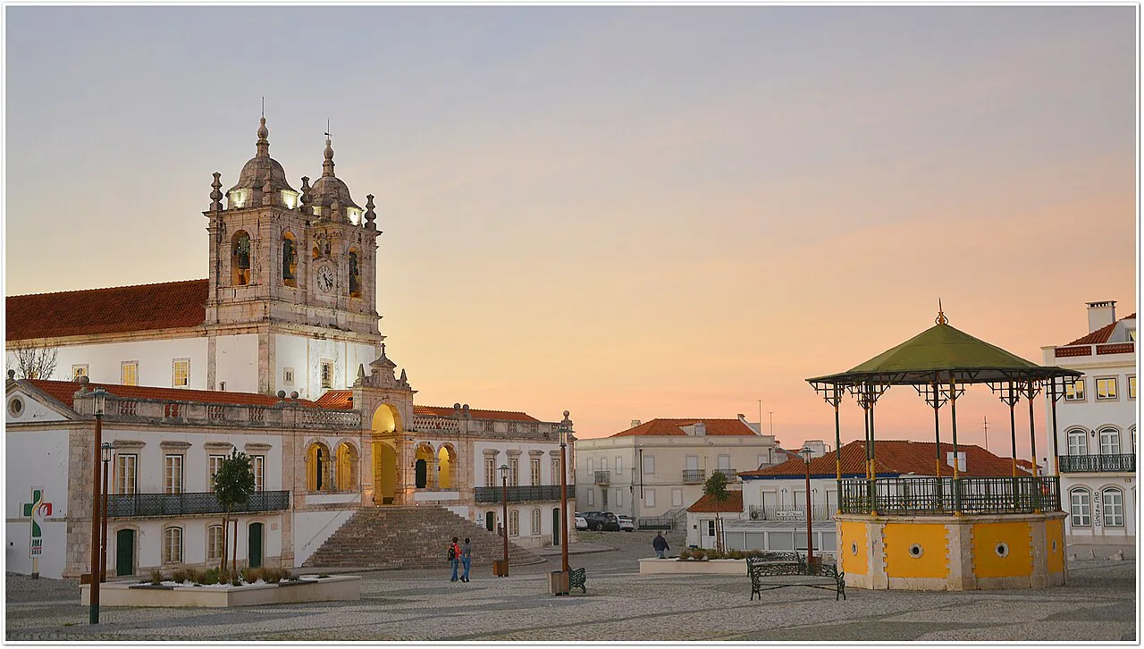 The Sanctuary of Nossa Senhora da Nazaré and its square at sunset.