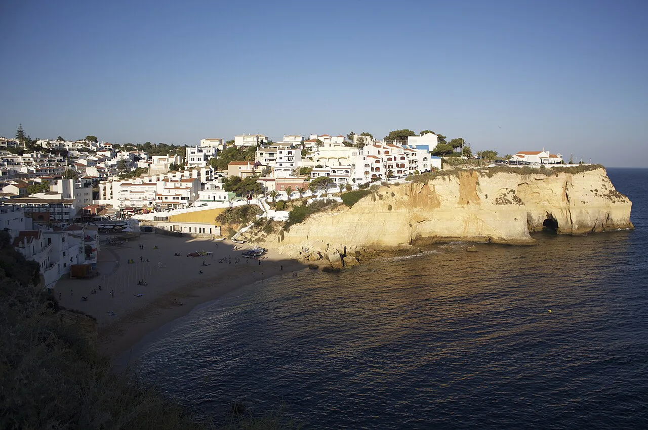 A general view of Carvoeiro village above its beach and cliffs.