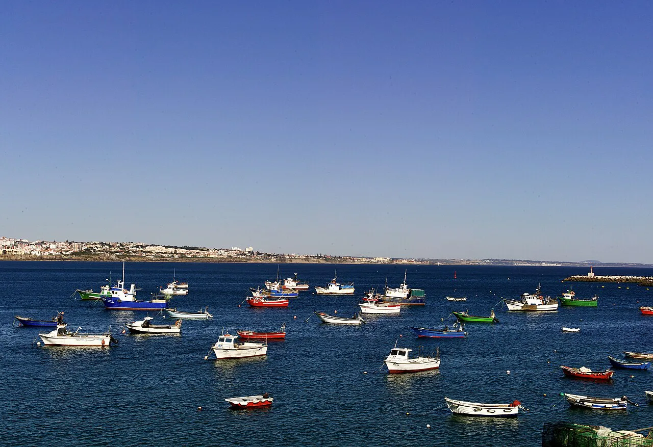 Fishing boats moored in Cascais harbour at the end of the day.