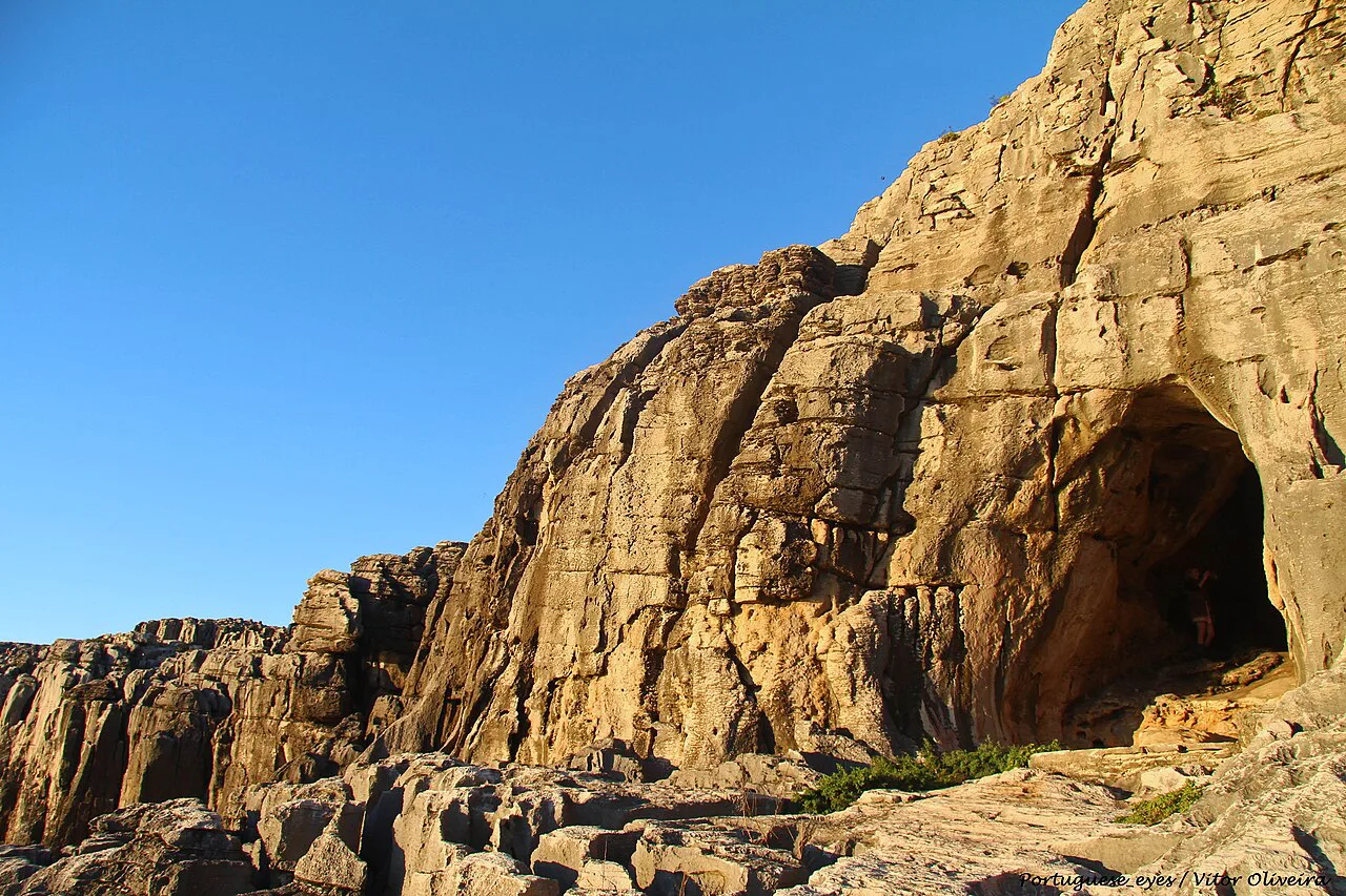 The cliff entrance to the Gruta da Furninha cave in Peniche.