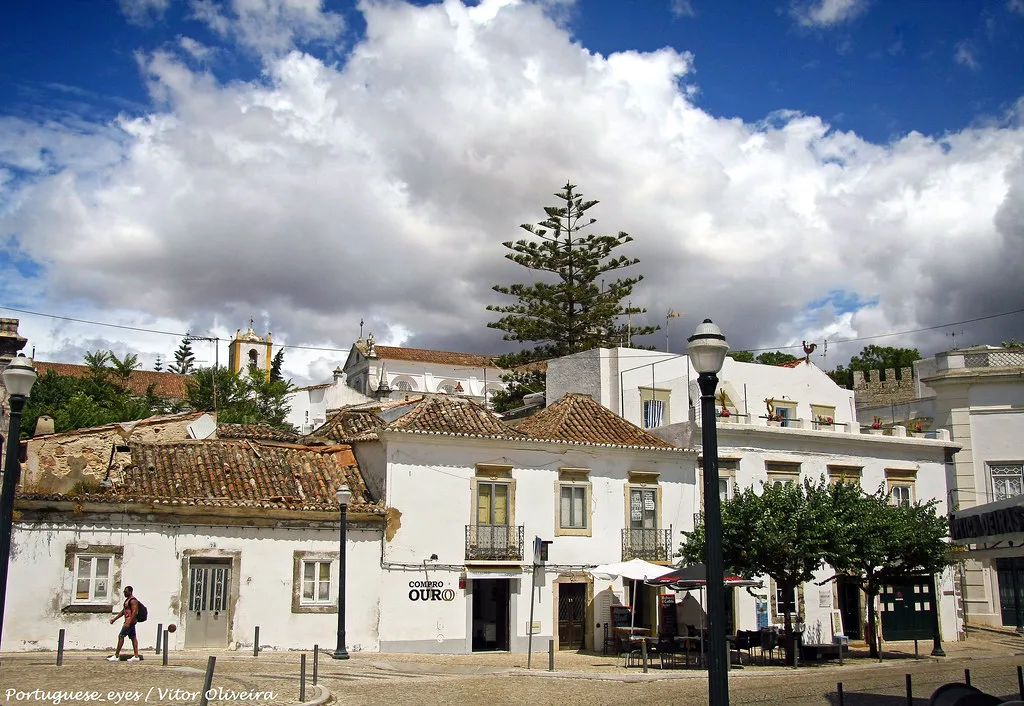 Whitewashed buildings around a square in Tavira.
