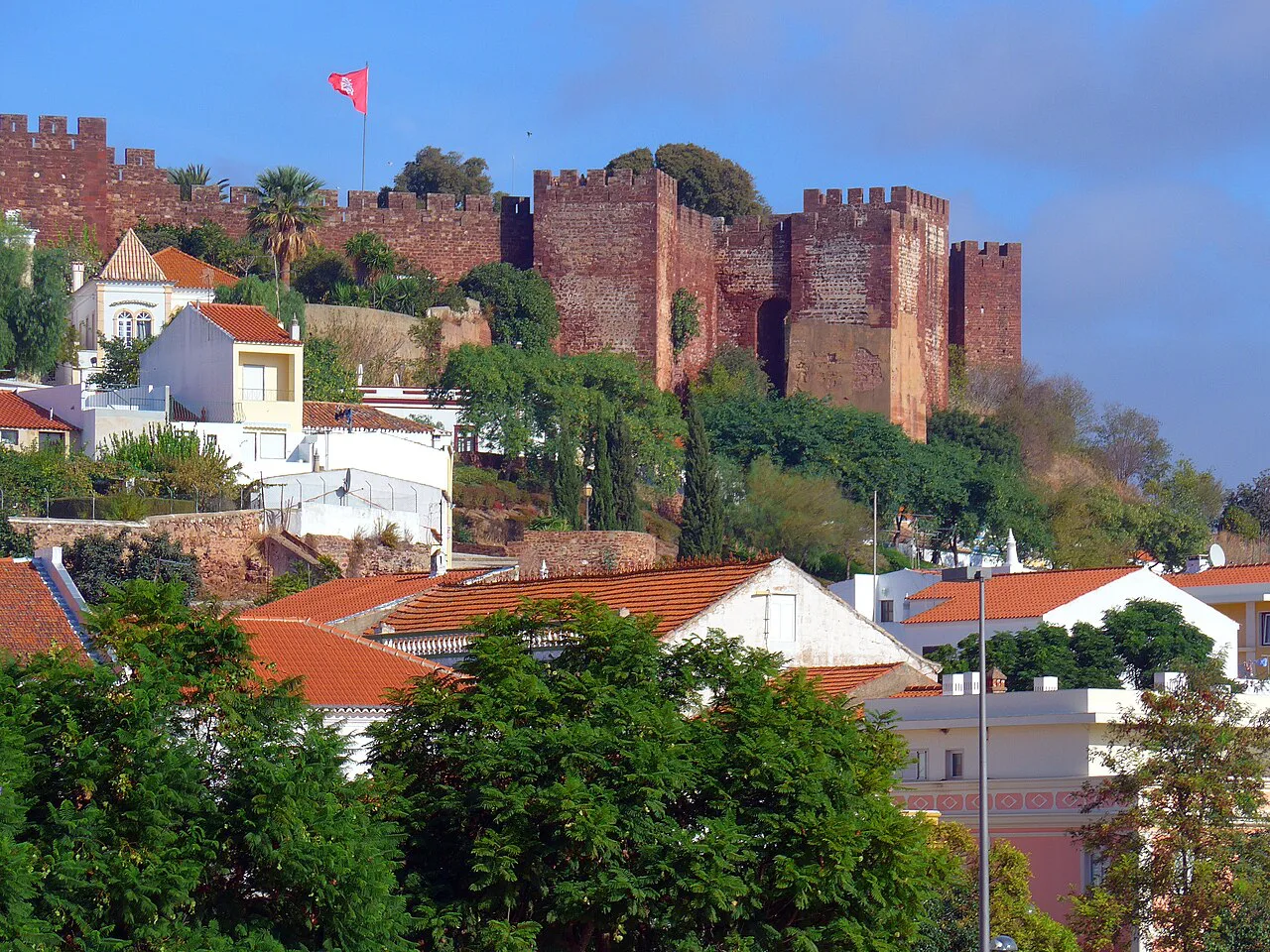 The red walls of Silves Castle above the town.
