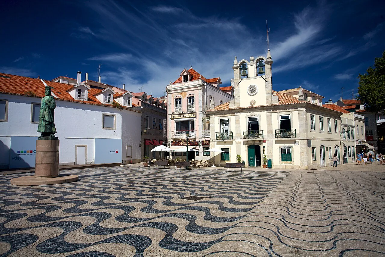 Wave-patterned calçada paving in a square in Cascais.