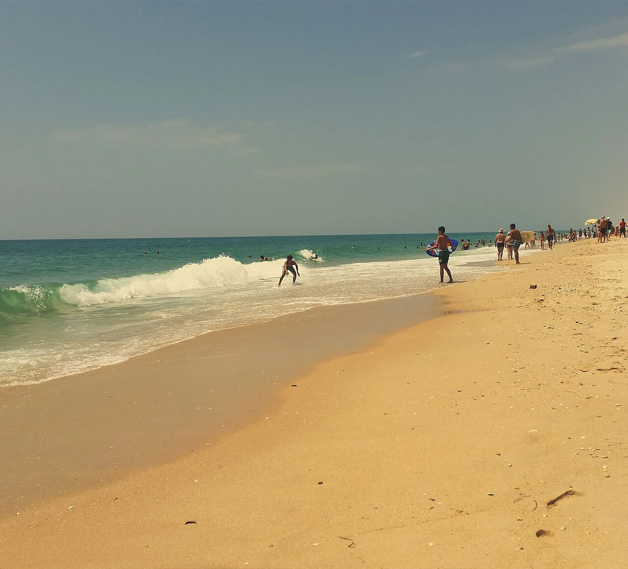Waves breaking on the sandy beach at Tavira Island.