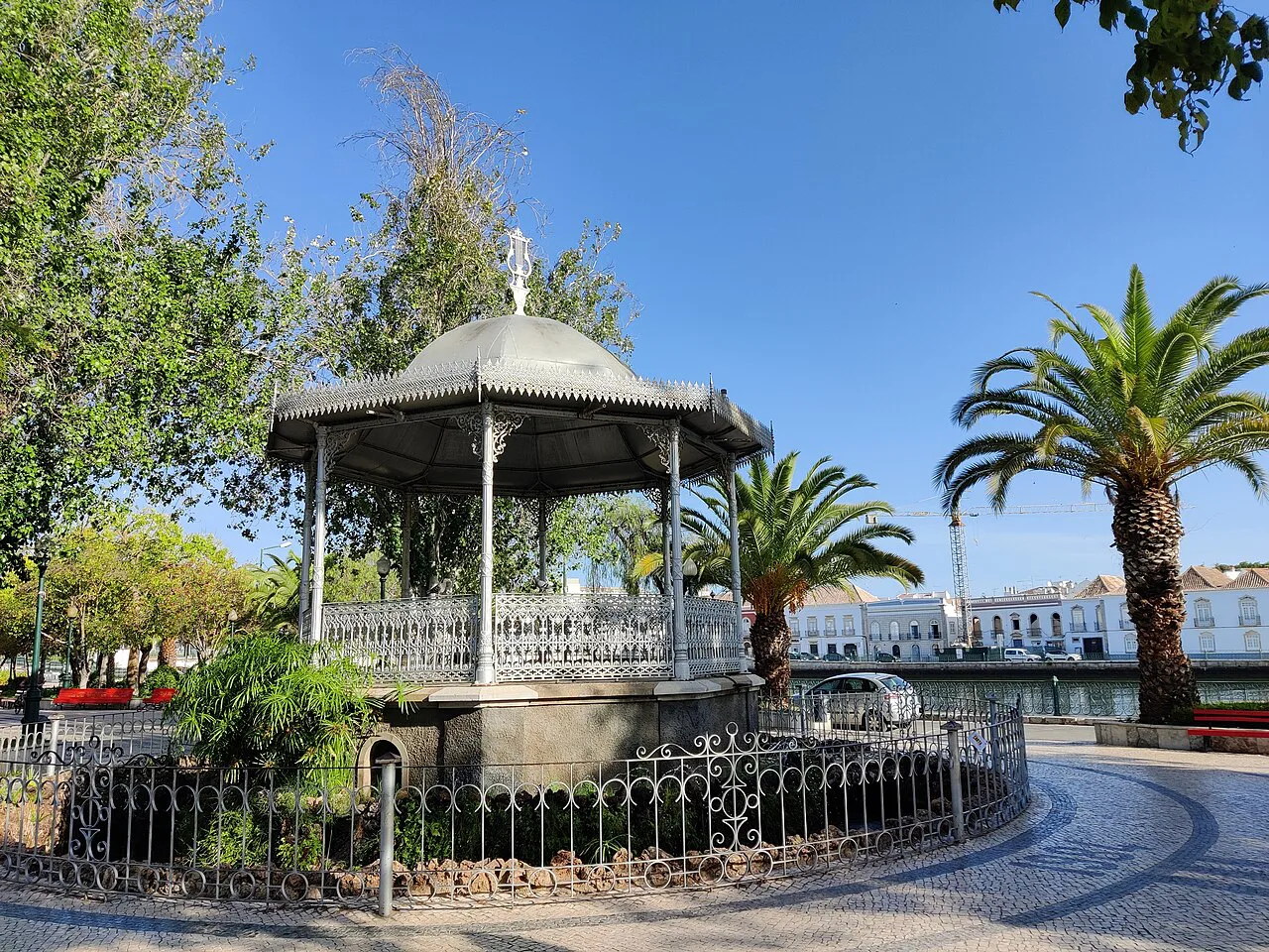 A bandstand among palm trees in a riverside garden in Tavira.