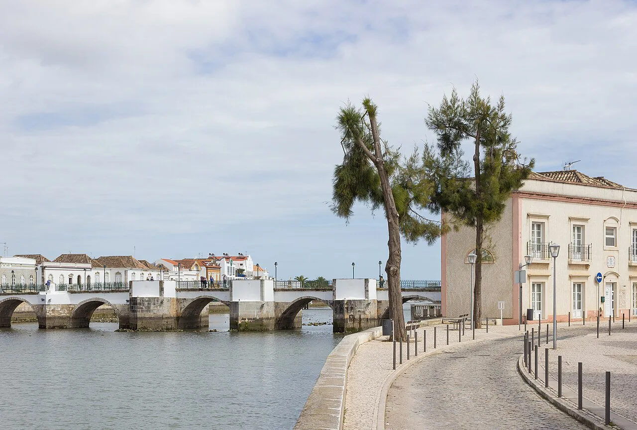 The riverbank in Tavira with the old bridge over the River Gilão.