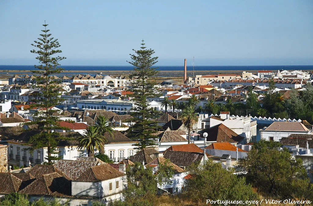 Rooftops of Tavira with the sea on the horizon.