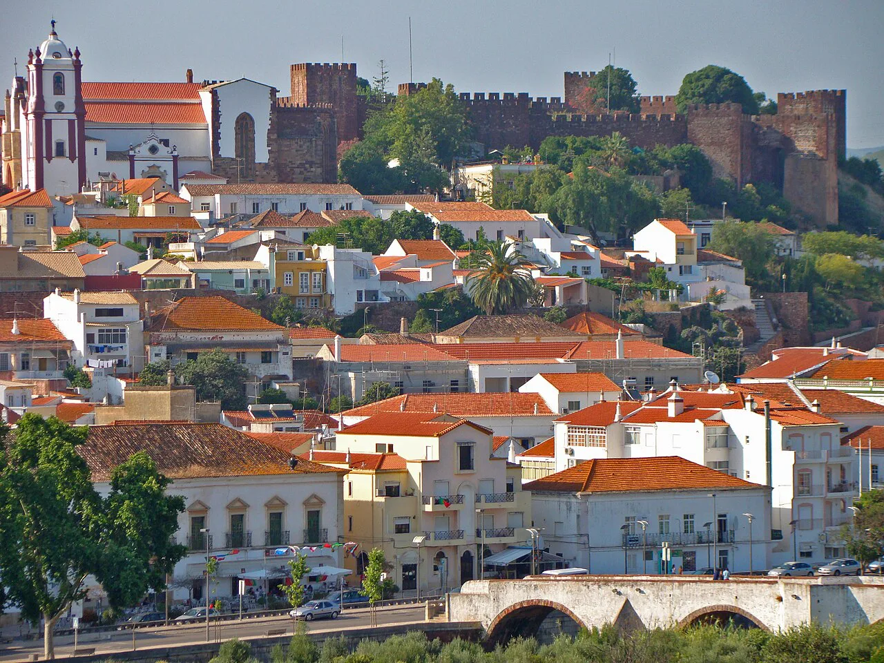 Rooftops of Silves rising towards the castle walls on the hill.
