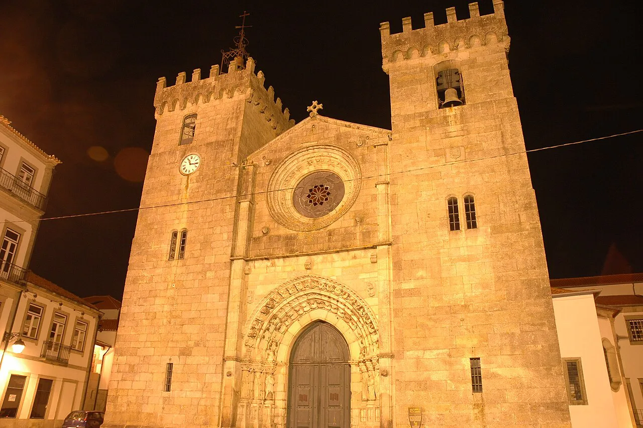 The façade of Viana do Castelo Cathedral, floodlit at night.