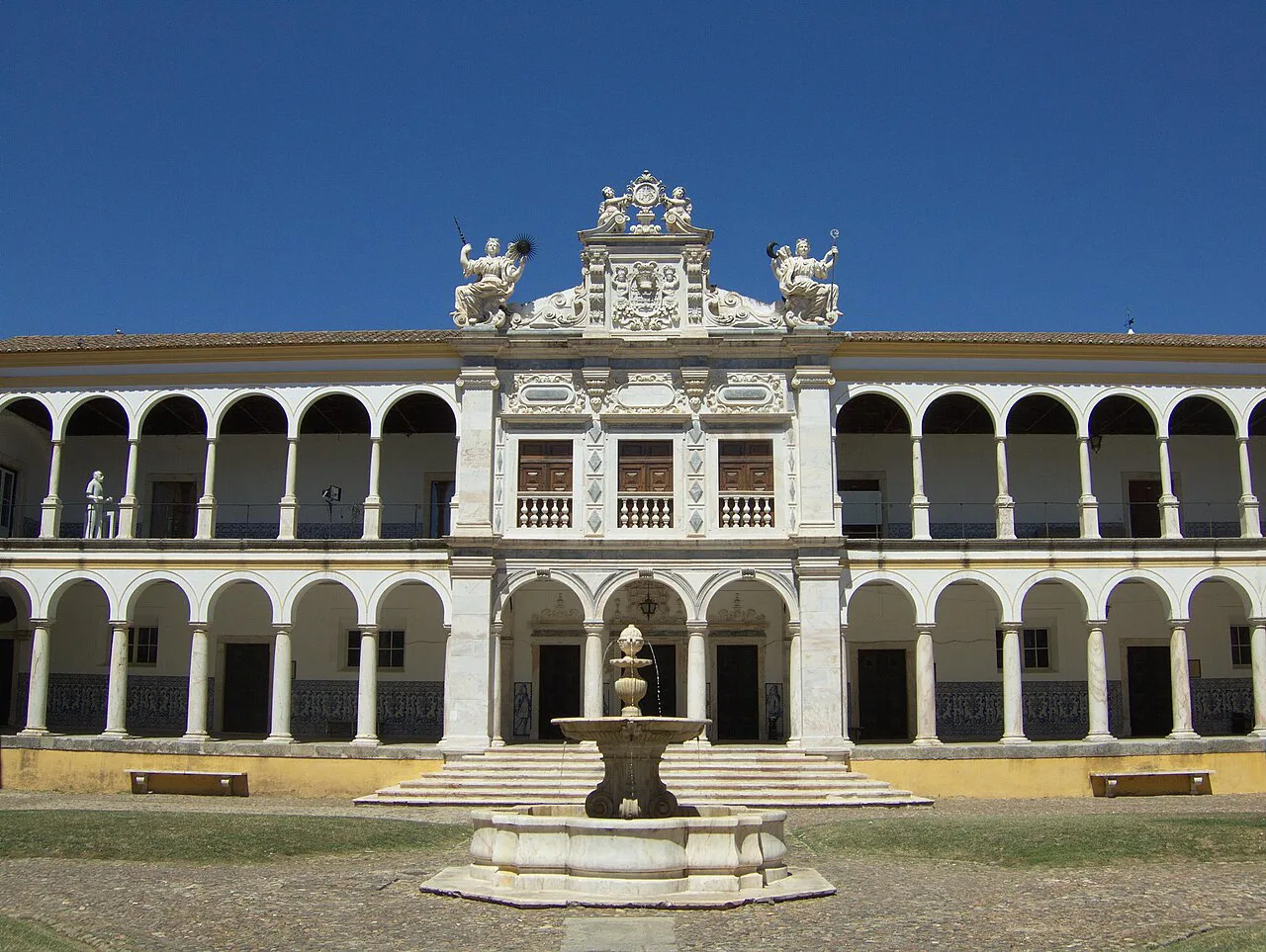 The arcaded courtyard and fountain of the University of Évora.