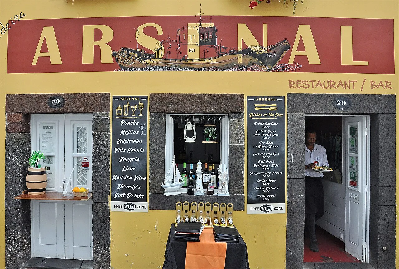 A restaurant with painted doors in the historic centre of Funchal, Madeira.
